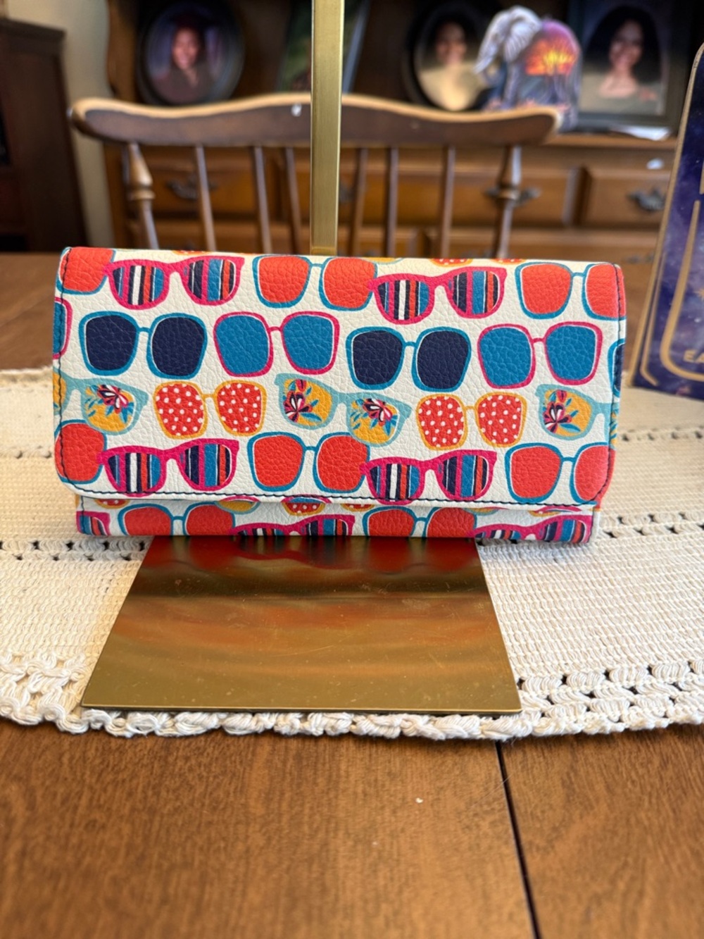 Relic wallet featuring vibrant, multi-colored print of various sunglasses styles
